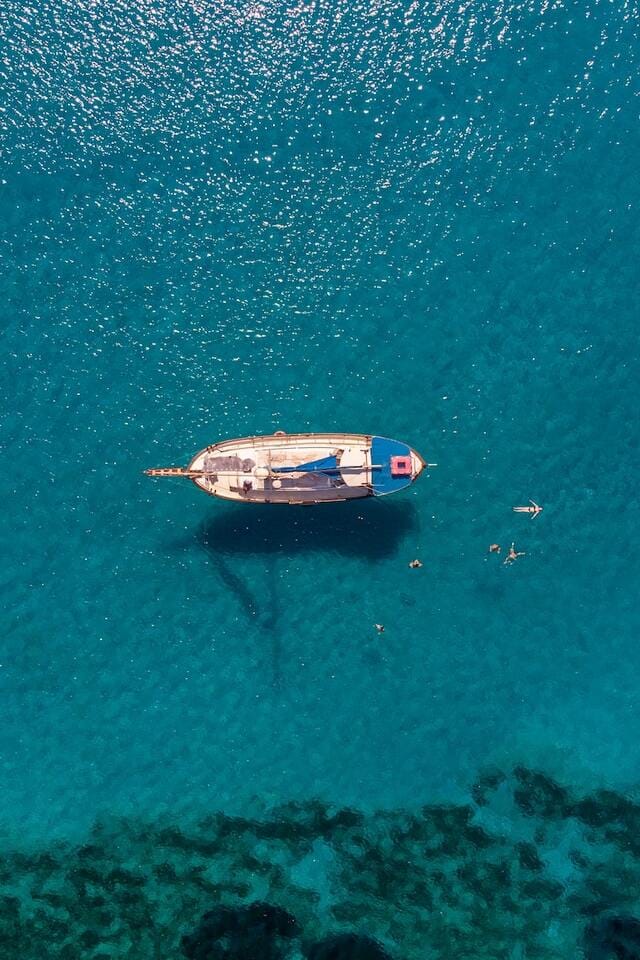 Sailboat over blue and green waters in Cyprus