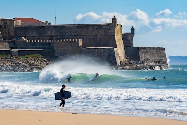 surfers at the beach of Carcavelos, Portugal