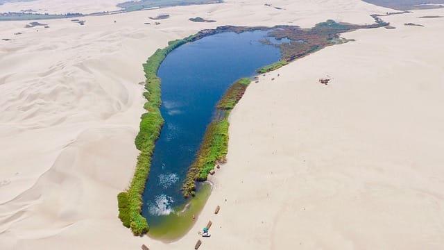 Aerial ica desert in peru lake oasis sand